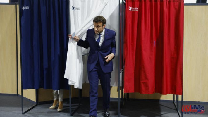 Macron and Le Pen clash in French presidential election, as voters head to the polls