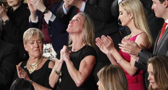 In emotional moment, Trump salutes slain SEAL’s wife