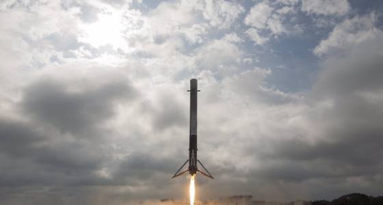 SpaceX says it will fly 2 people to moon next year 