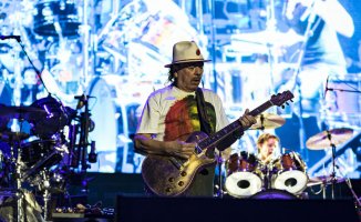 During a show near Detroit, Carlos Santana falls on the stage