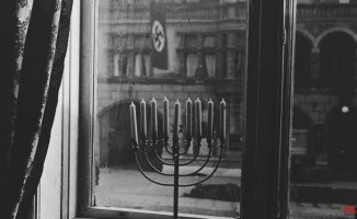 Hanukkah lights in front of the Nazis