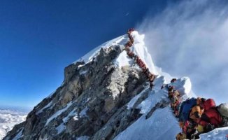 Nepal issues record 454 permits to climb Everest