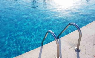 The Government will allow community pools to open "in the hottest months"