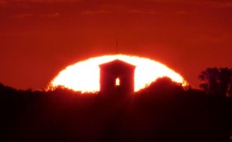 The sun risen from a bell tower