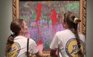 Two activists arrested after staining a Monet painting with red paint in Stockholm