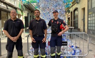 Firefighters check the streets of Gràcia before the upcoming neighborhood festivities