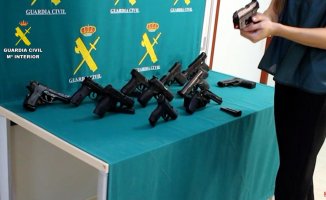 13 pistols seized from a man who sold weapons to criminal groups