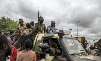 At least 49 civilians and 15 soldiers die in an attack on a passenger ship in Mali