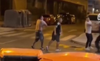 A local Madrid policeman breaks up a slap fight