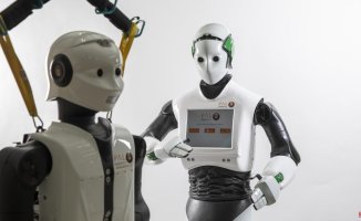 The robots coordinate without human intervention through a bidding and auction system