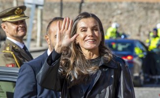 Letizia dresses in a leather trench coat and takes off her heels