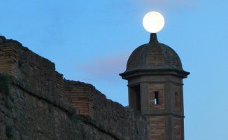 The moon crowns the tower of the Castle of Cardona