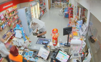 A thief who robbed a service area with a cardboard box on his head was arrested