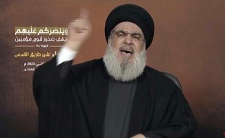 Hasan Nasrallah, the warrior leader, sits waiting