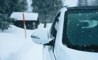 What should you do if you get stuck with your car in the snow