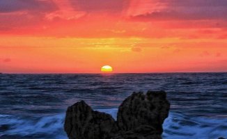 The sun rises over the Saint Valentine's rock in Garraf